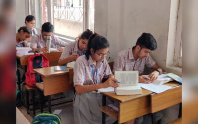 Students at a Delhi school refer to the Bhagavad-gita while taking an offline exam in 2019